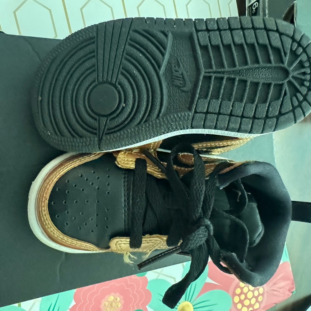 Jordan Black and Gold Sneakers with Basketball Silhouette